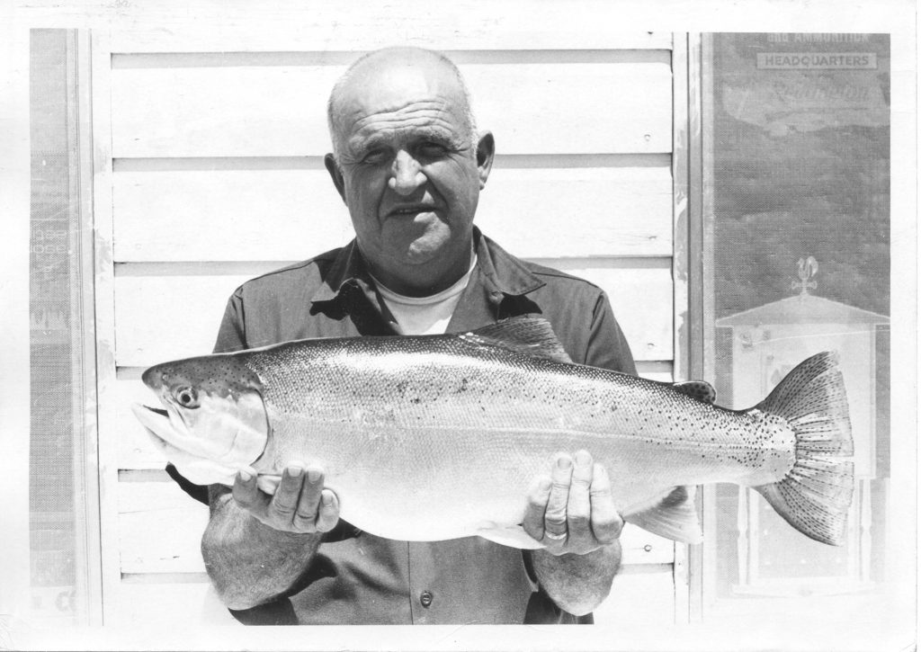 Man holding state record rainbow trout